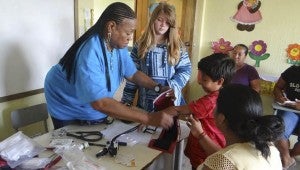 Nurse Rose Utendahl checks children’s vitals at a three-day medical clinic.