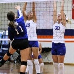 Jump for it: Chilton County’s Dana Kelley (No. 28) and Adrianna Shavers (30) block a Marbury shot during Thursday’s match.