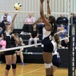 Push it over: Isabella's Jayda Jones tries to get a shot over Jemison's Cassani Steele during Monday's match. (Photo by Brandon Sumrall)