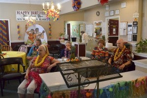 Residents at the Gardens of Clanton enjoy a special singing from The Chosen Two while celebrating “Hawaiian Day” on Tuesday. The celebration is part of National Assisted Living Week. 