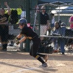 Makaela Tindol of Billingsley drops down a bunt in attempt to reach base.