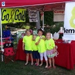 (Left to right) Millie Cleckler, Mary Henning Dale, Ellie Grace Reece and Anna Lynn White helped start the Lemon8 stand by setting up at Peach Park in 2014. (Contributed Photo) 