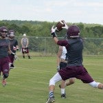 Thorsby tosses for a score against Jemison during a 7-on-7 camp hosted by Isabella High School on Monday.