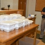 Boxes of food from Peach Park awaited the arrival of police officers on various shifts throughout the day. (Photo by Anthony Richards)