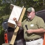 Chris Jaworowski of the Extension Center shows off a constructed house for a wood duck.