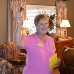 Sondra Henley rings a bell to announce a winner in the raffle drawing. A winner was chosen every 15 minutes. 