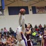 Damian Wilson of CCHS hauls in an offensive rebound in the post. 